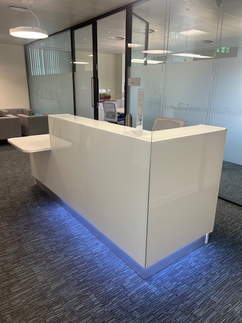 reception desk with uplighters.